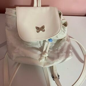 Elegant White Backpack with Butterfly Accent